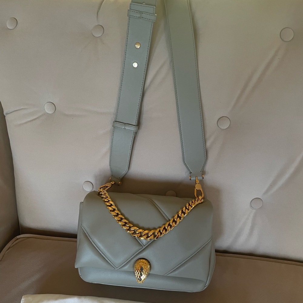 Excellent condition. I’ve worn a couple of times.  Shoulder strap is removable.